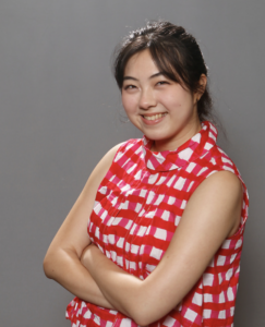 Young asian woman wearing a red and white checked shirt