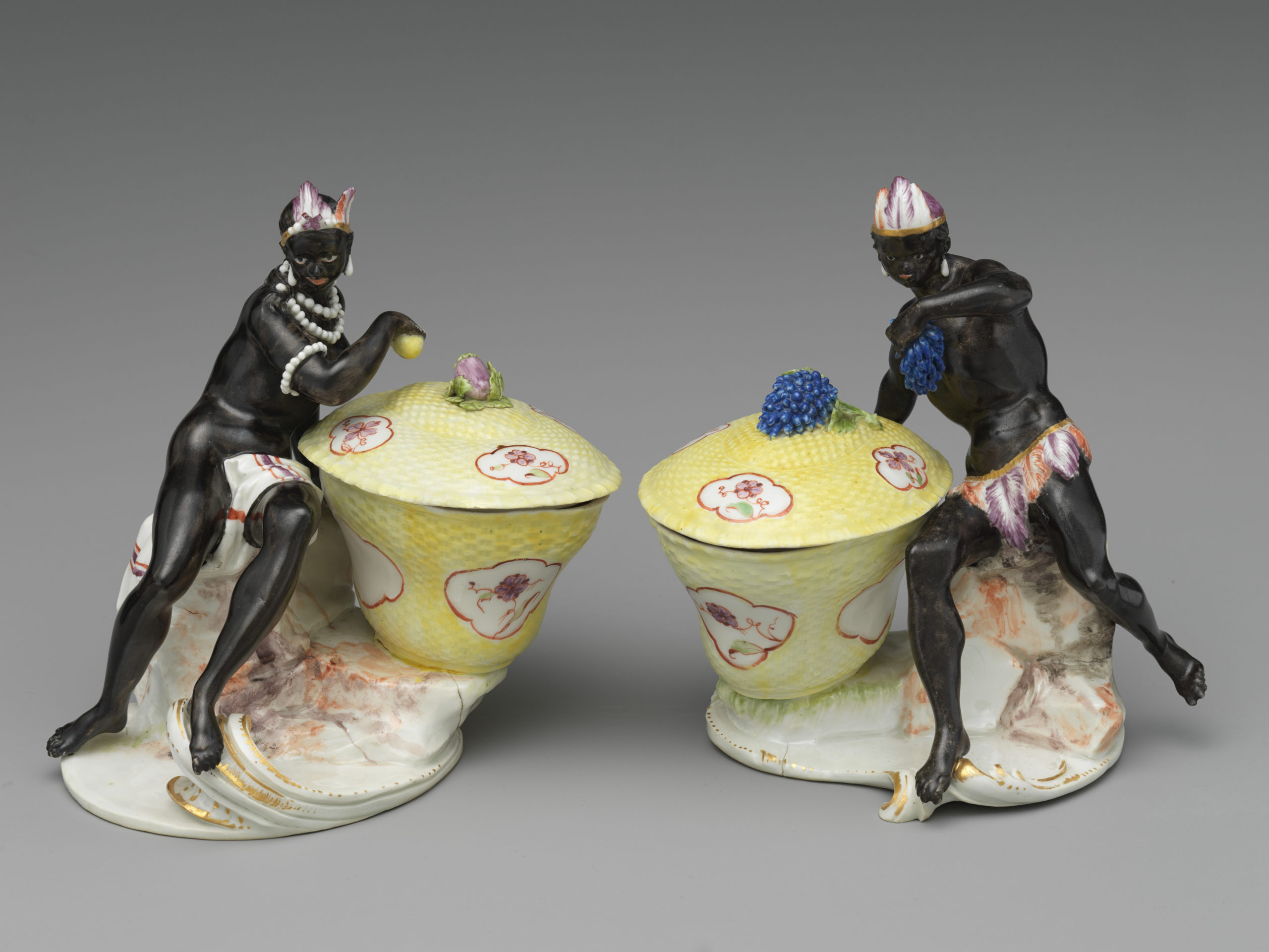 Pair of Sugar boxes with mostly naked Black figures that appear exoticized