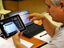 Faculty member using a tablet