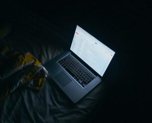 Laptop opened in dark room