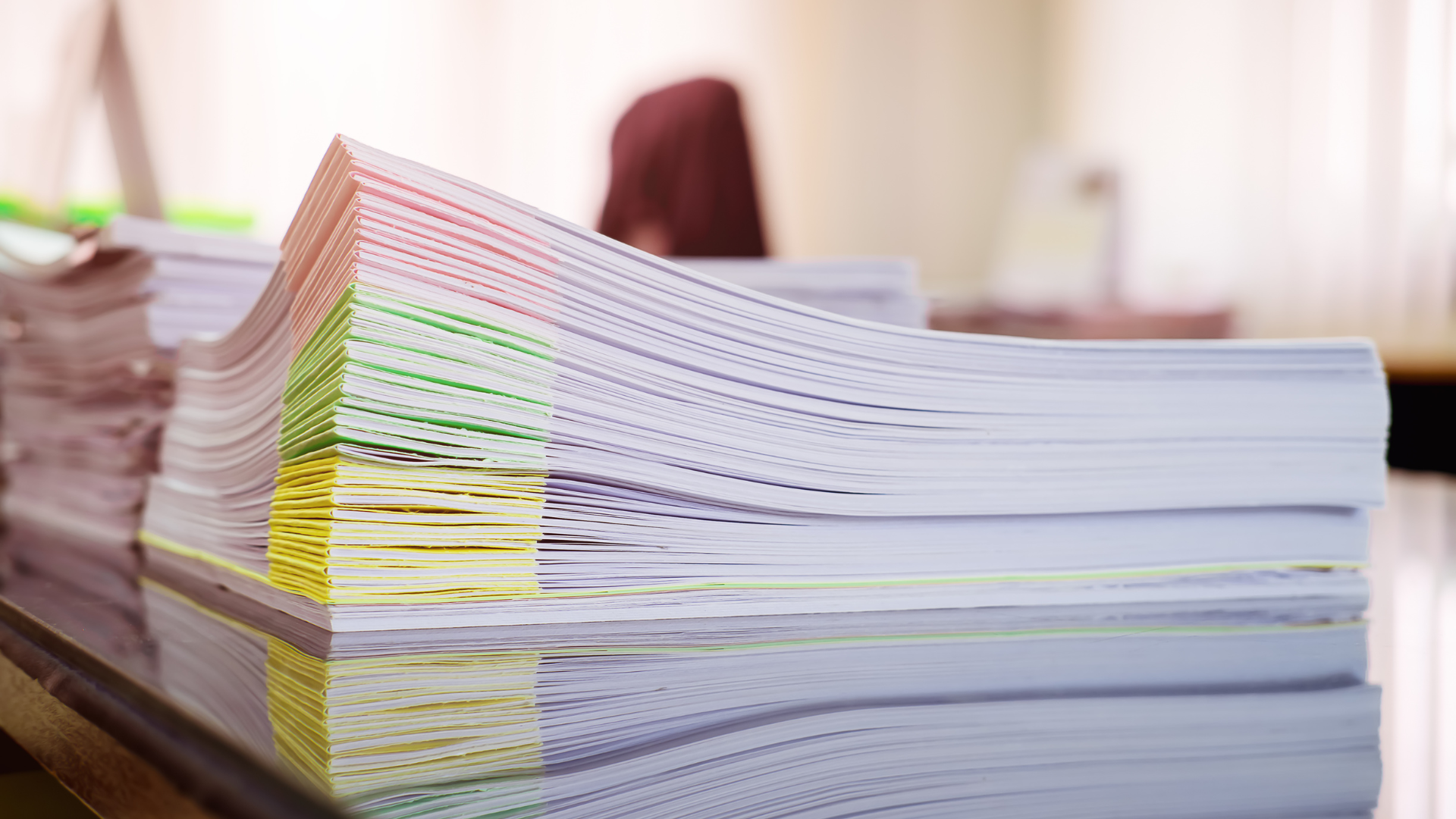 Stacks of paper on a desk