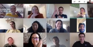 A screenshot of a Google Meets call with 12 people smiling and clapping.