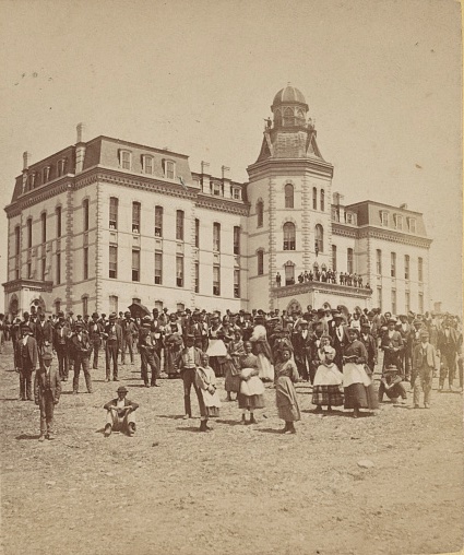 students in front of a university building