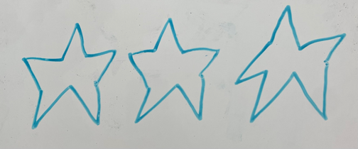 Hand-drawn wobbly stars on a whiteboard
